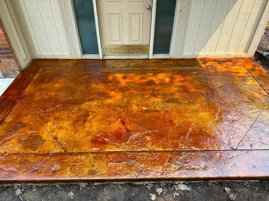 Acid-stained front porch. Stamped slate texture with a hand-applied stain.