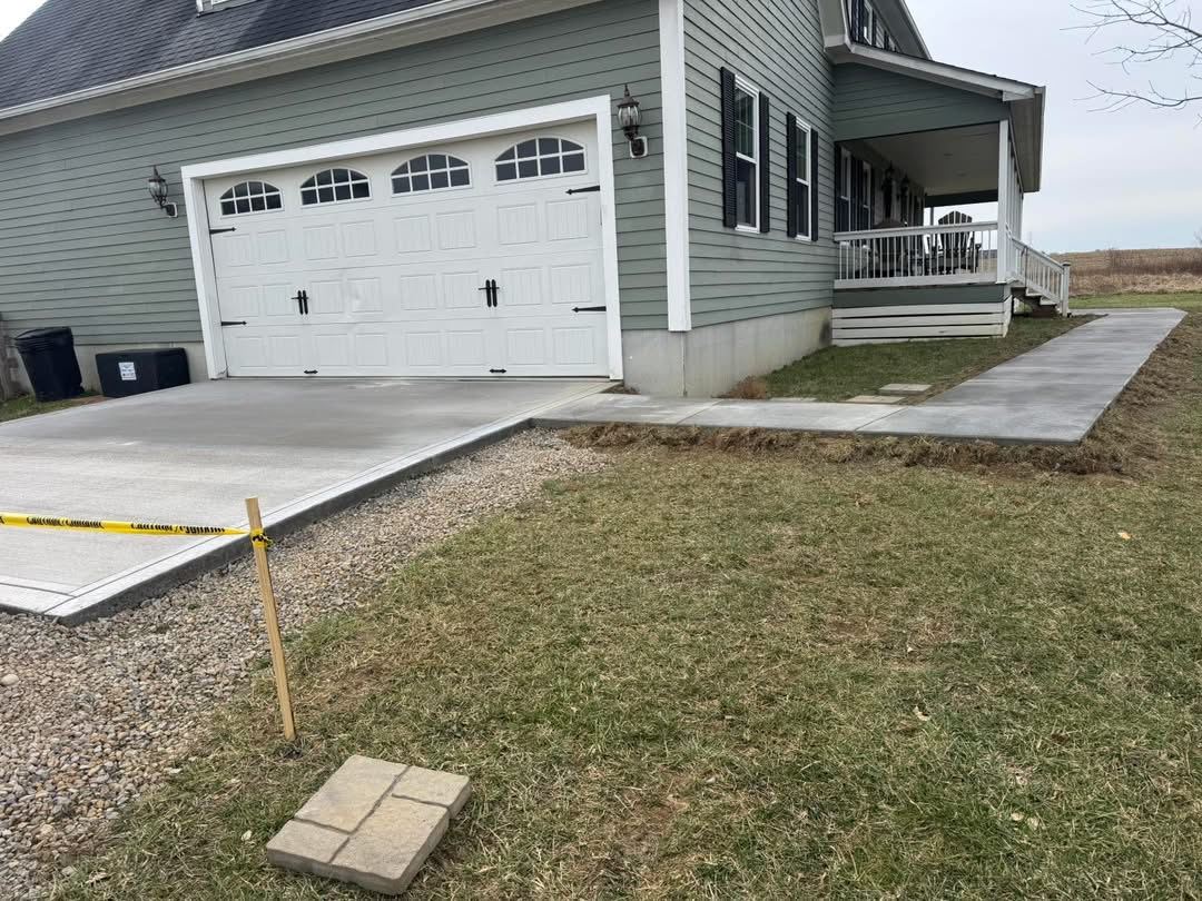 Driveway and front walk. New driveway pad and walkway to the porch.