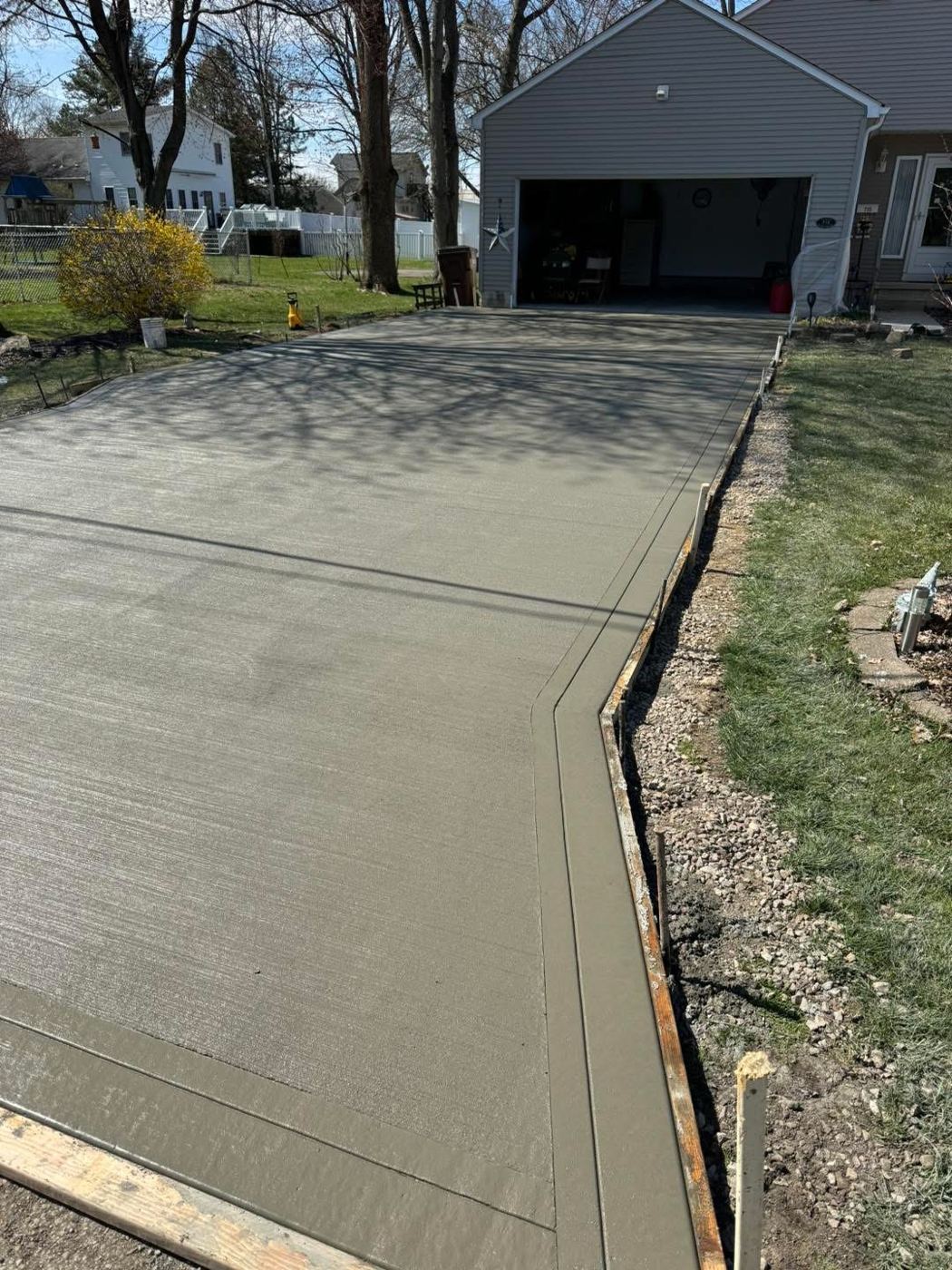 Driveway with border. Broom finish with a smooth-trowel border.