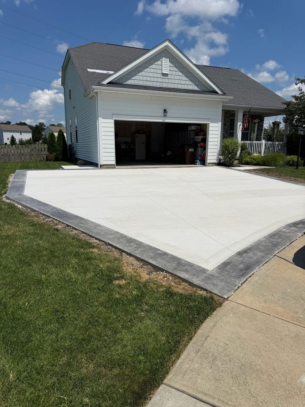 Driveway with stamped border. New driveway framed in a charcoal stamped border.
