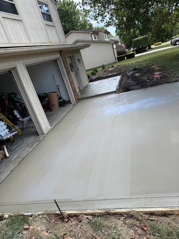 Garage apron and driveway. Tied into the garage slab and a new stamped walk.