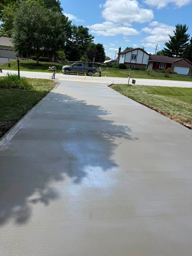 Driveway replacement. Full-length driveway poured to the street.
