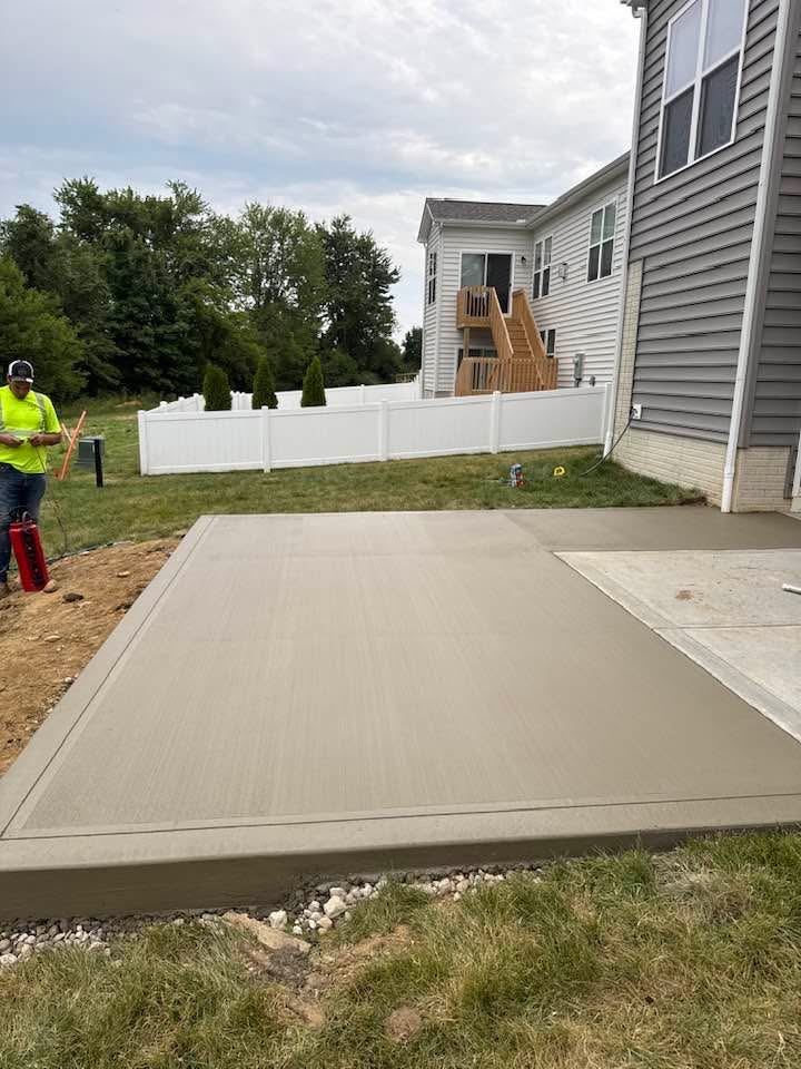 Patio extension. Added onto an existing slab with a clean border.