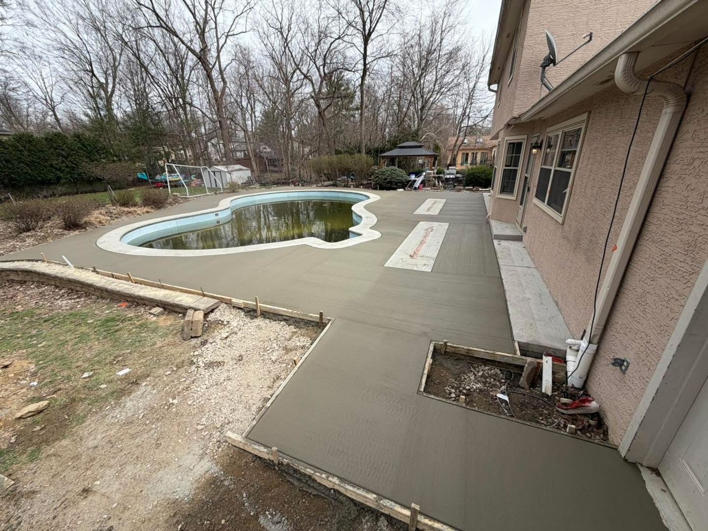 Pool deck. New broom-finish deck around an in-ground pool.
