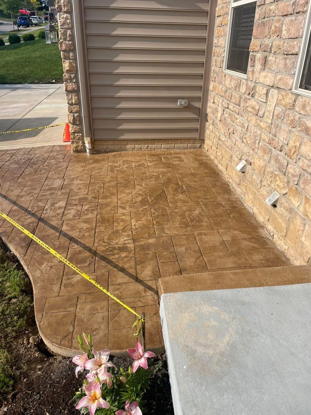 Stained, stamped patio. Ashlar-slate pattern with a warm stain.